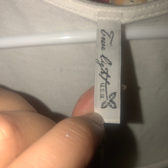 𝅺True Light White Tunic Blouse with Black Asymmetrical Trim - Picture 5 of 5